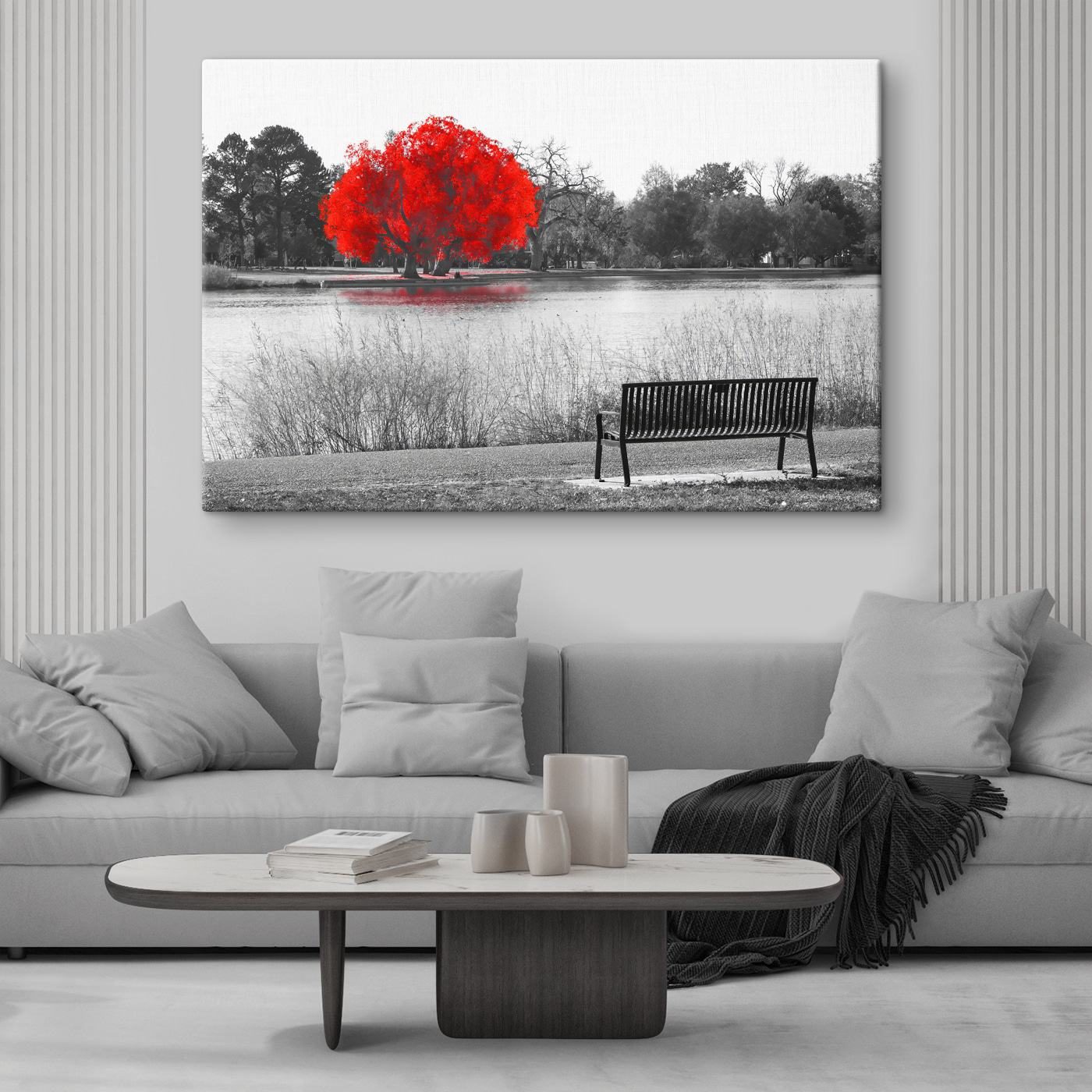 A bench by a lake with a red tree A bench by a lake with a red tree