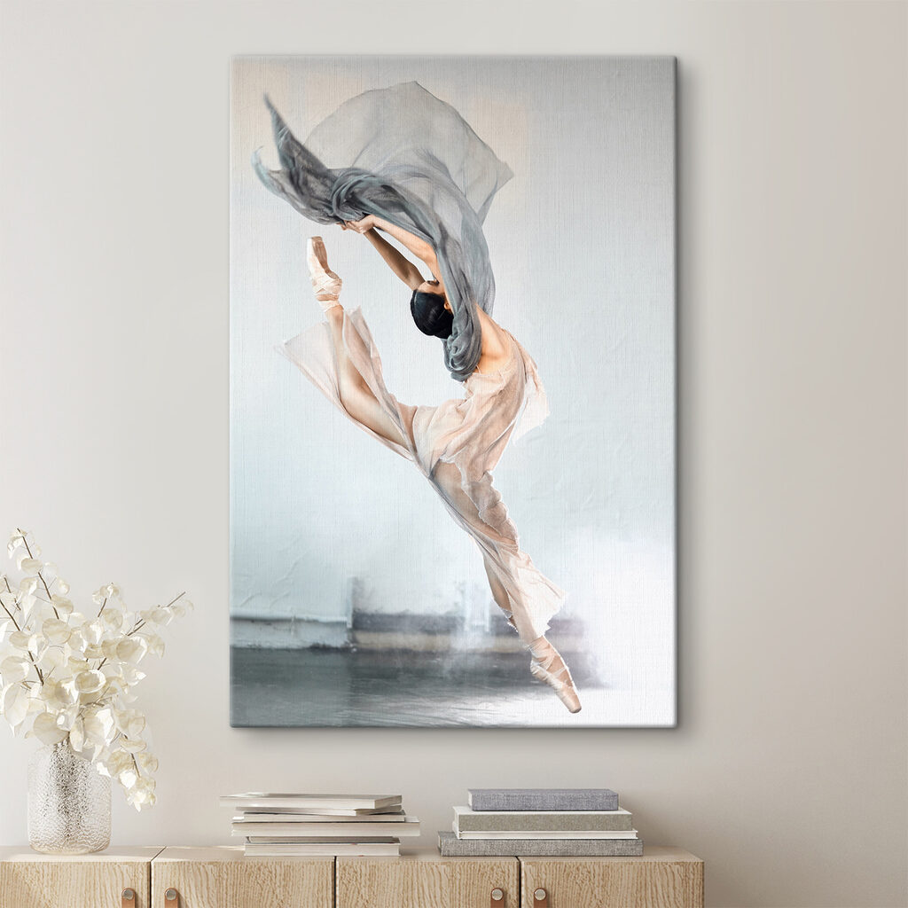 A woman in a dress and pointe shoes jumping in the air