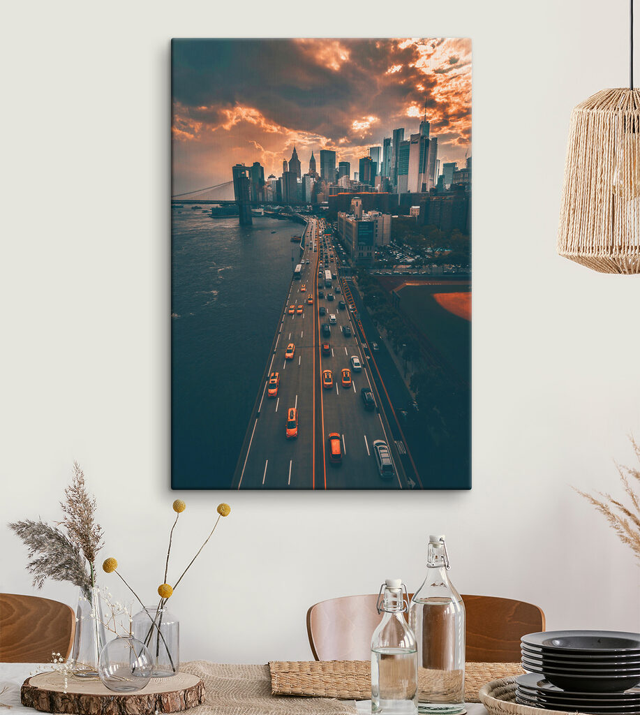 A bridge over water with cars and buildings in the background A bridge over water with cars and buildings in the background