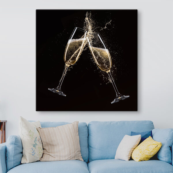 Two glasses of champagne with splashing liquid