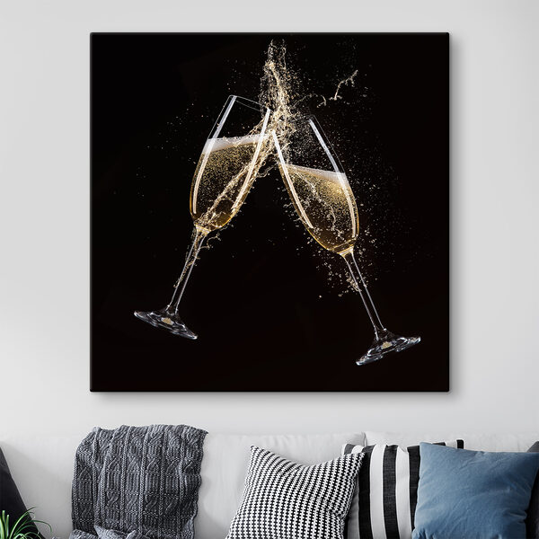 Two glasses of champagne with splashing liquid