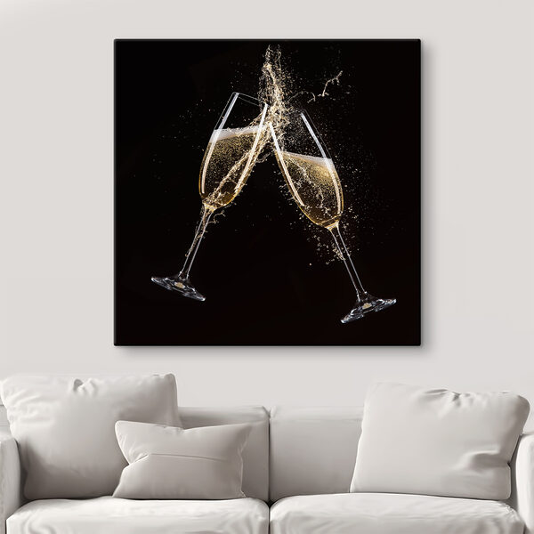 Two glasses of champagne with splashing liquid