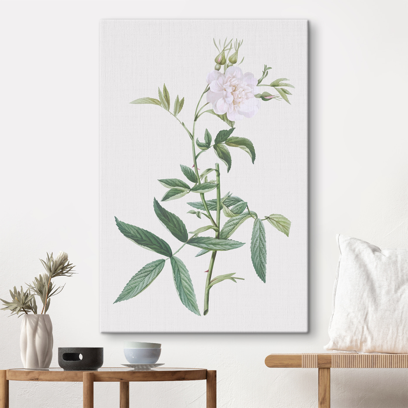 A white flower with green leaves