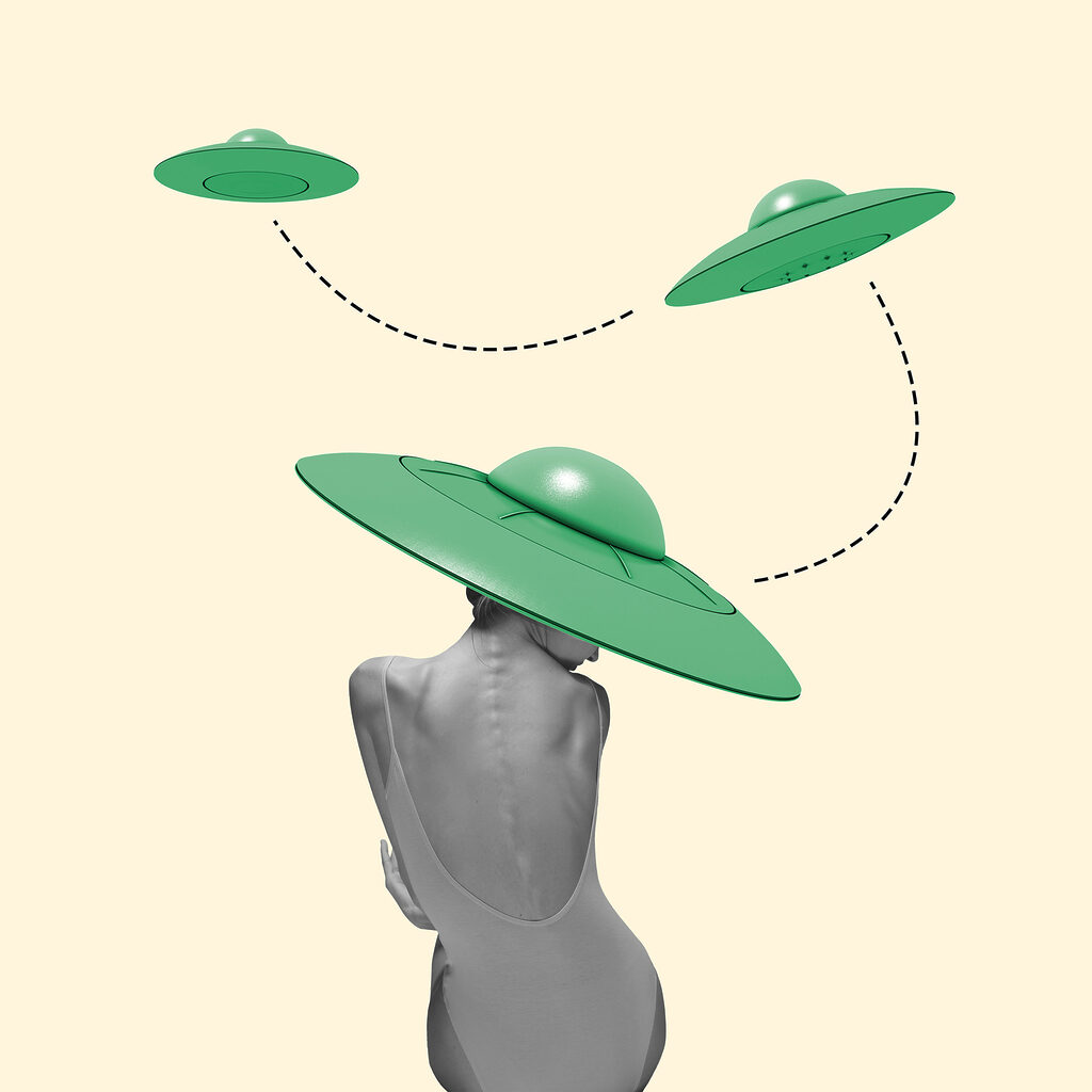 A woman wearing a bodysuit and a green hat