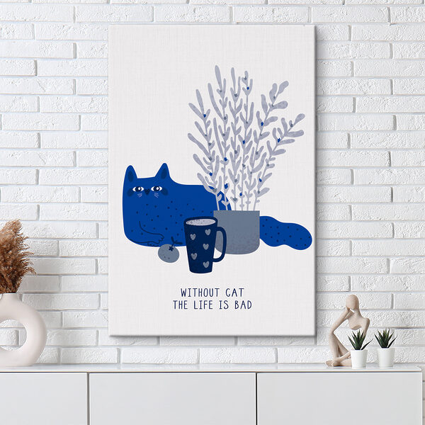 A cat sitting next to a cup and a plant A cat sitting next to a cup and a plant