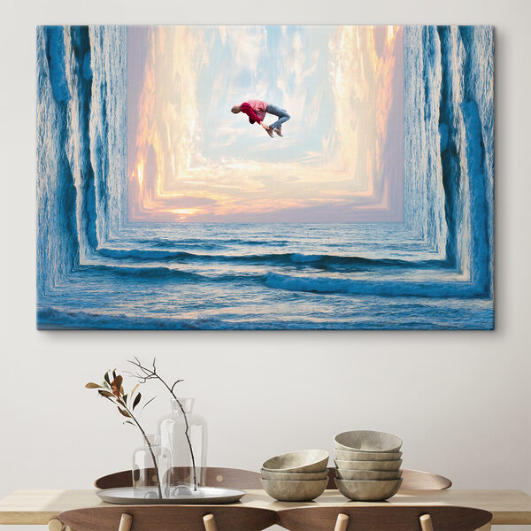 A man jumping in the air over water