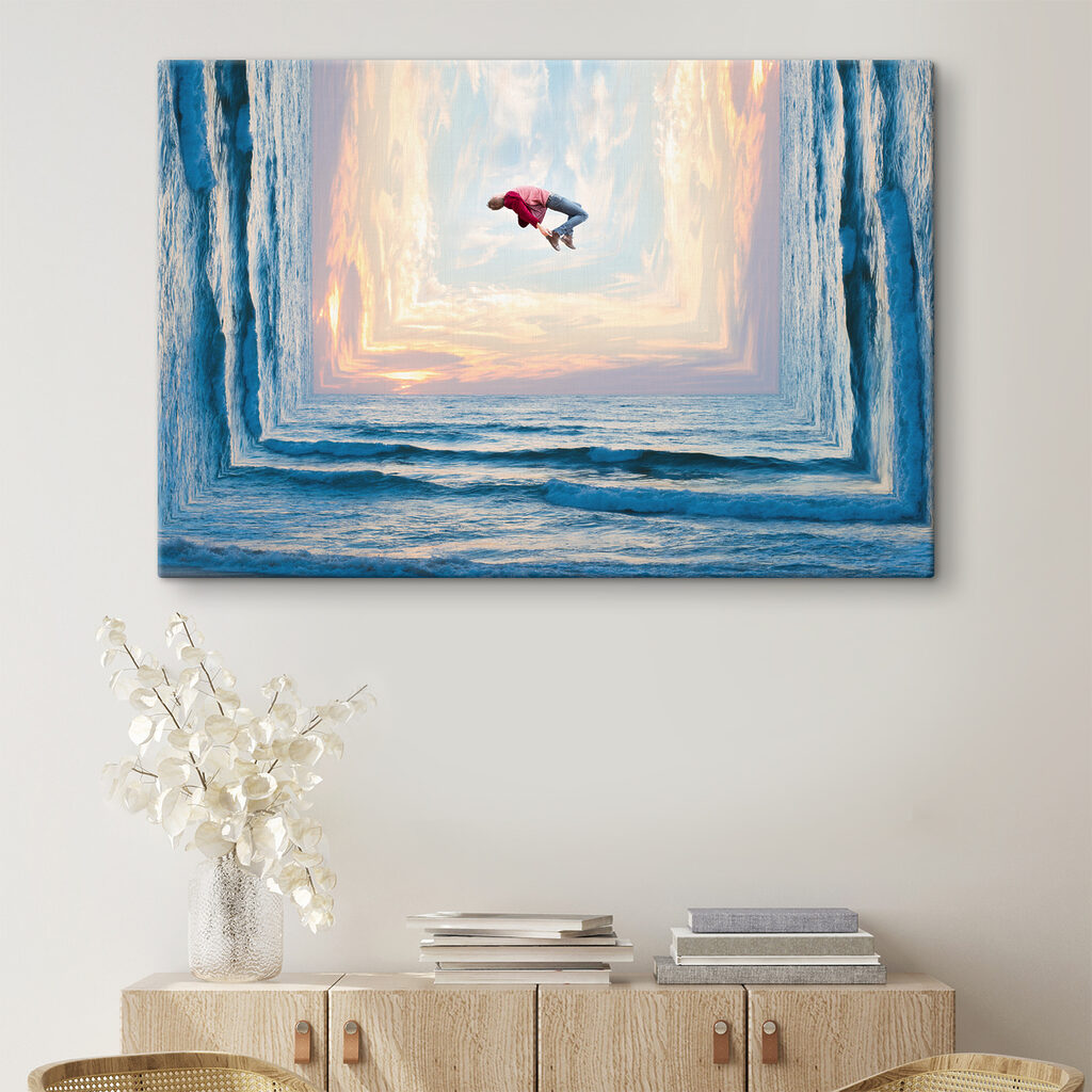 A man jumping in the air over water