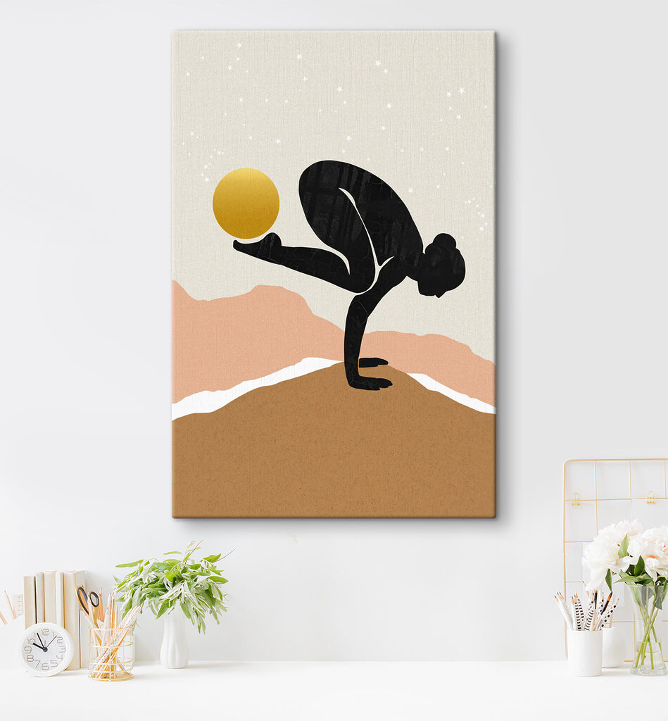 A woman doing a handstand with a yellow ball