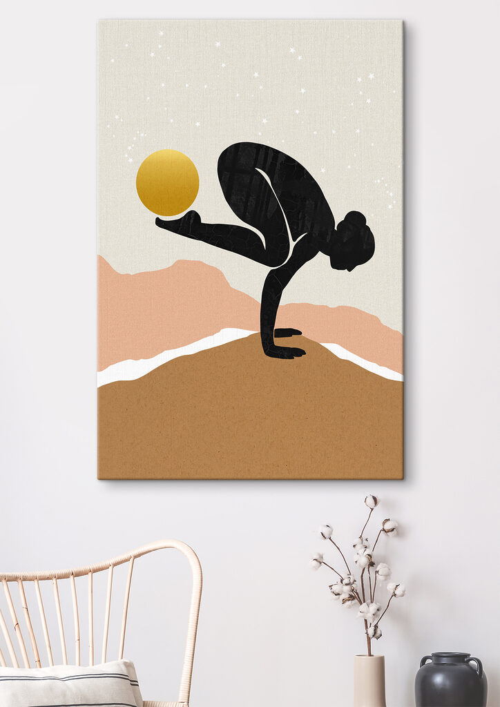 A woman doing a handstand with a yellow ball