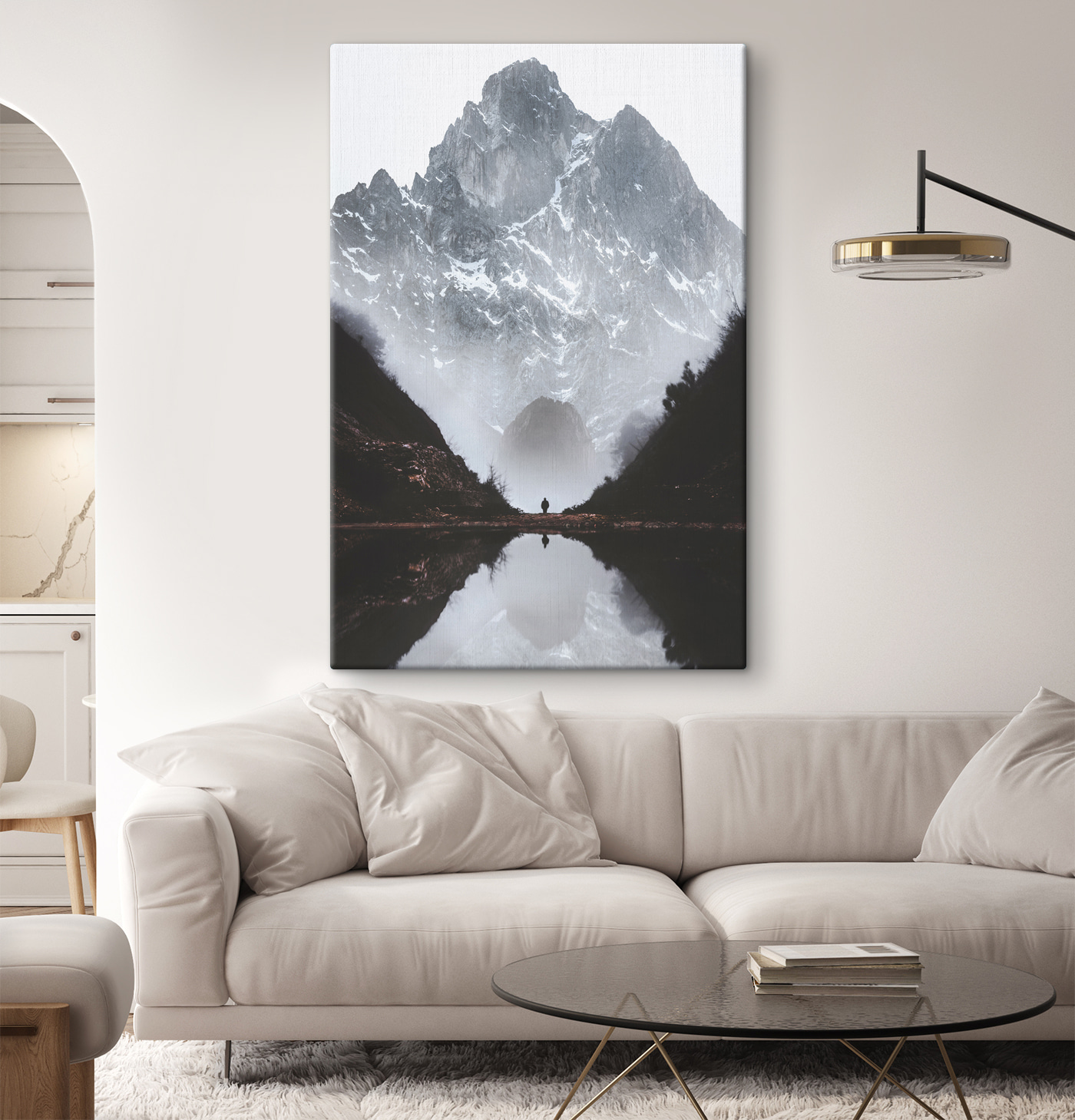 A person standing in a valley with a mountain in the background