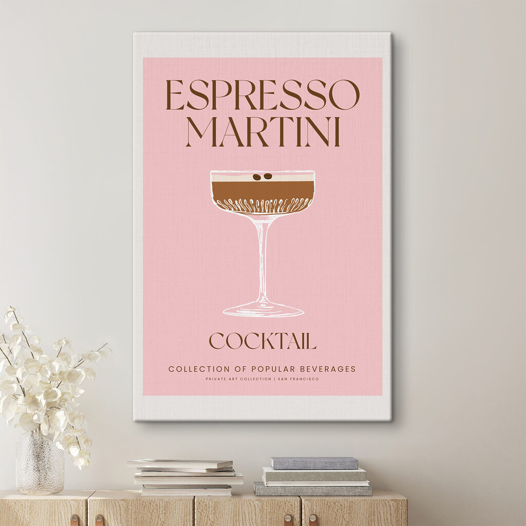 A pink and white sign with a glass of brown liquid