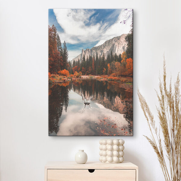 A lake surrounded by trees and mountains