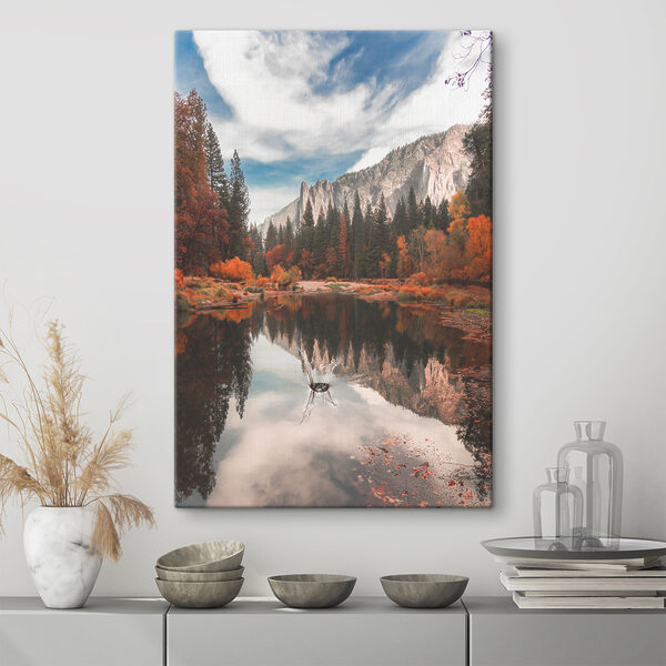 A lake surrounded by trees and mountains