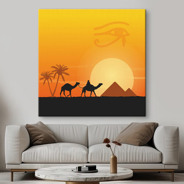 Cuadros Unos camellos y unas palmeras frente a una puesta de sol
