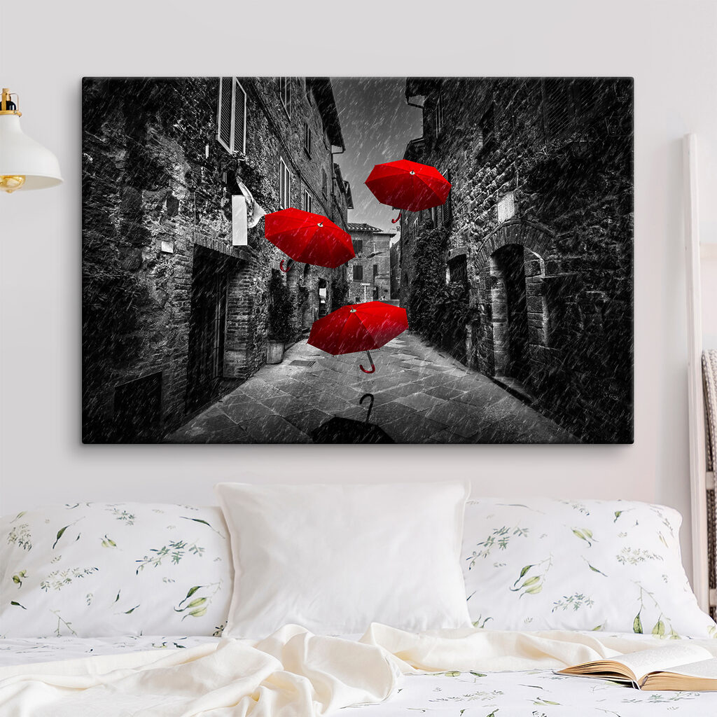 A group of red umbrellas flying in the air