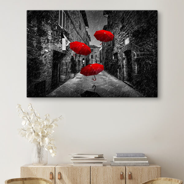 A group of red umbrellas flying in the air