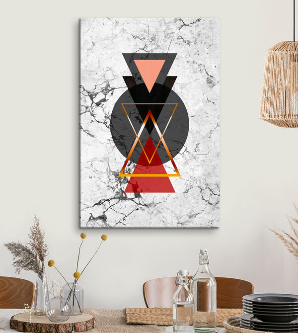 A black and red triangle and circle on a marble surface A black and red triangle and circle on a marble surface