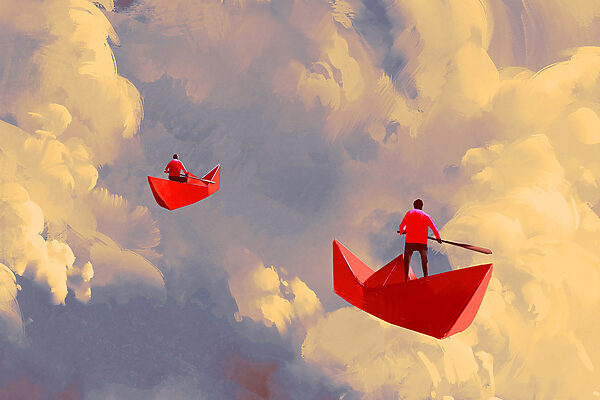 Two people in red boats in the sky