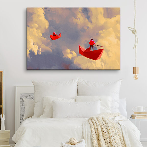 Two people in red boats in the sky