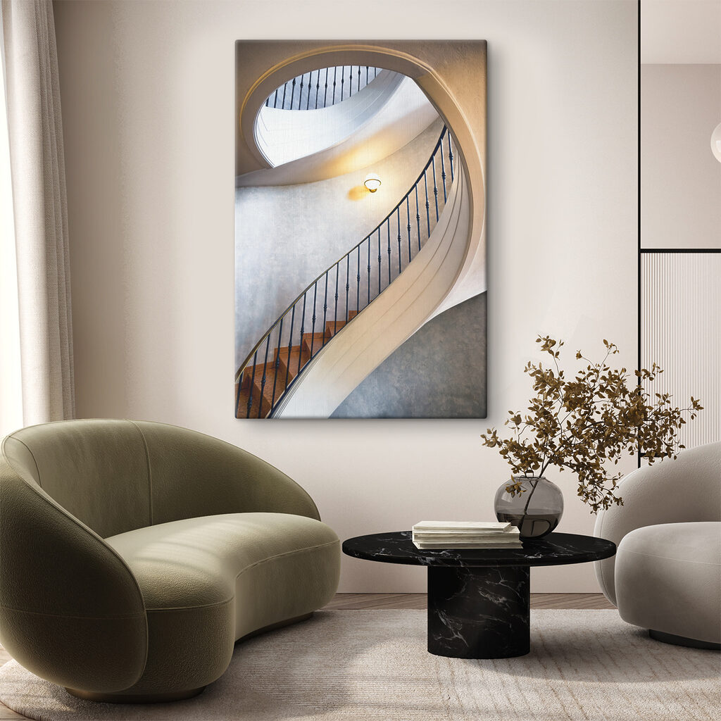 A spiral staircase with a black railing