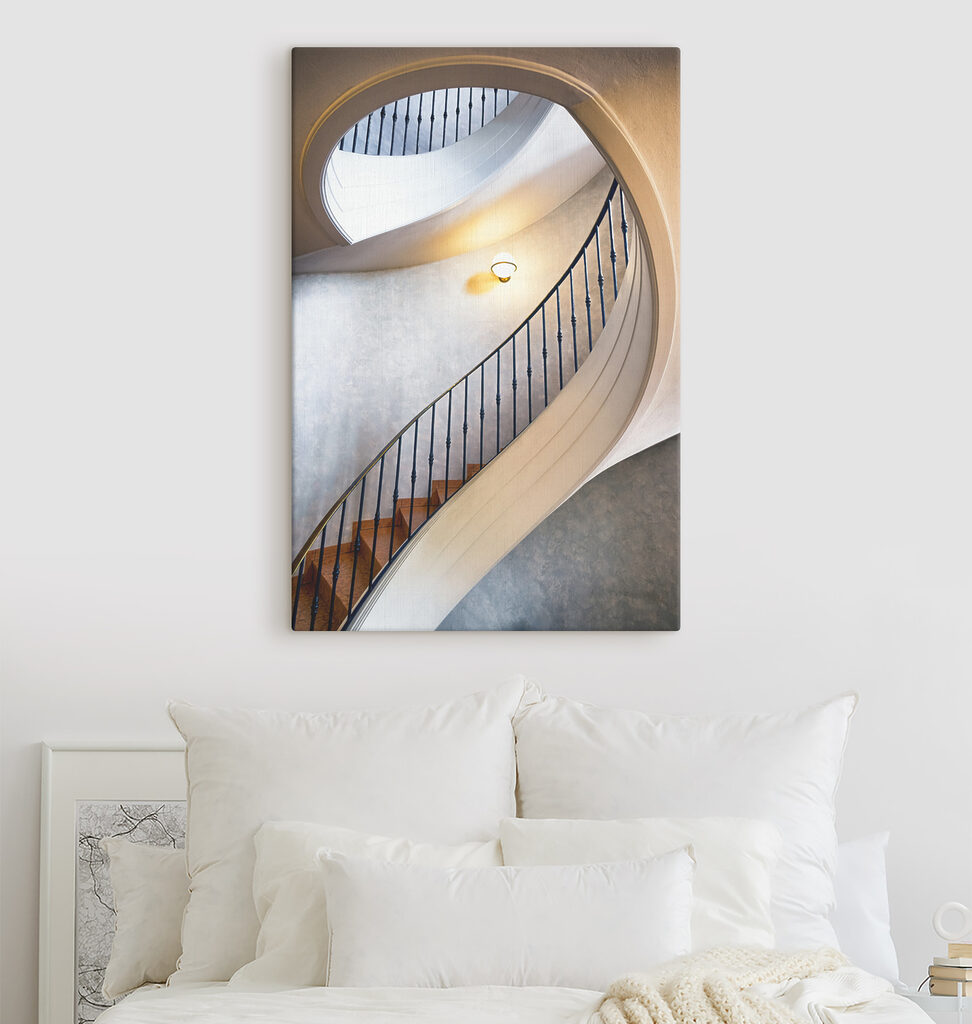 A spiral staircase with a black railing
