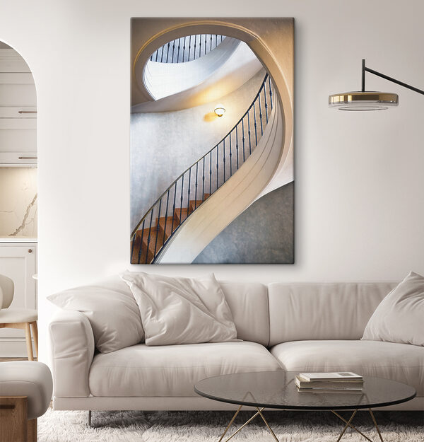 A spiral staircase with a black railing