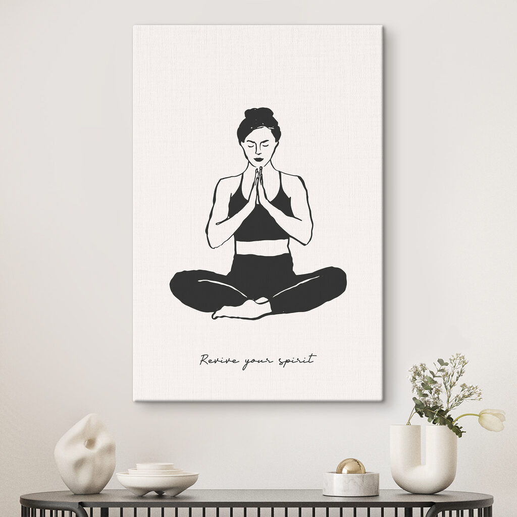A woman sitting cross legged with her hands together
