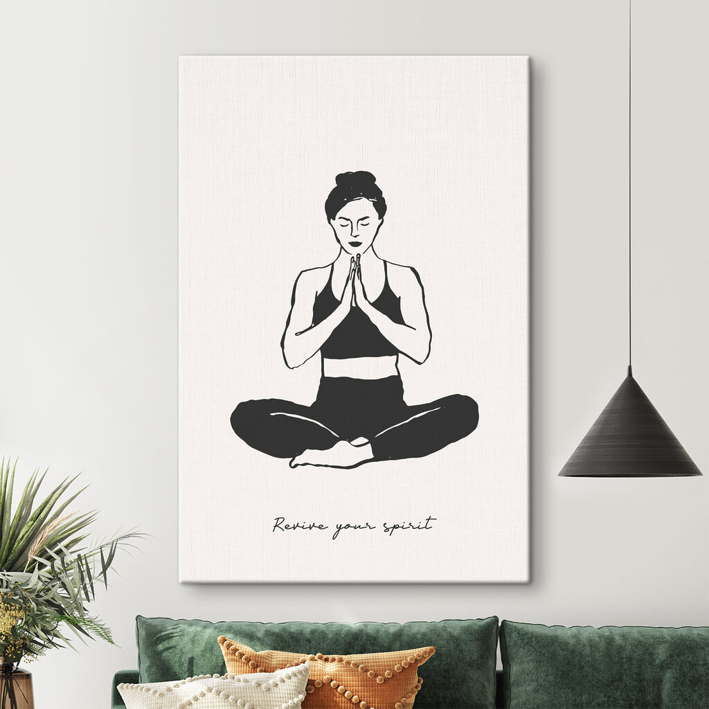 A woman sitting cross legged with her hands together