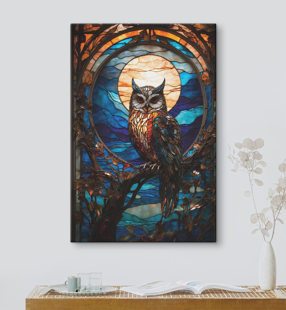 A stained glass owl on a tree branch A stained glass owl on a tree branch