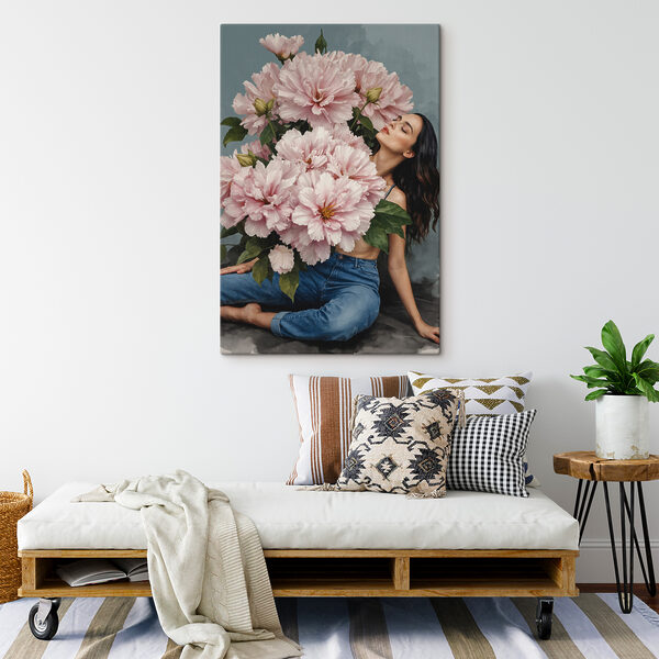 A woman sitting on a floor with a large bouquet of flowers A woman sitting on a floor with a large bouquet of flowers