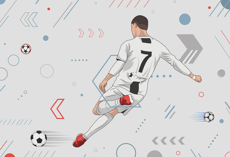 Un jugador de fútbol pateando un balón