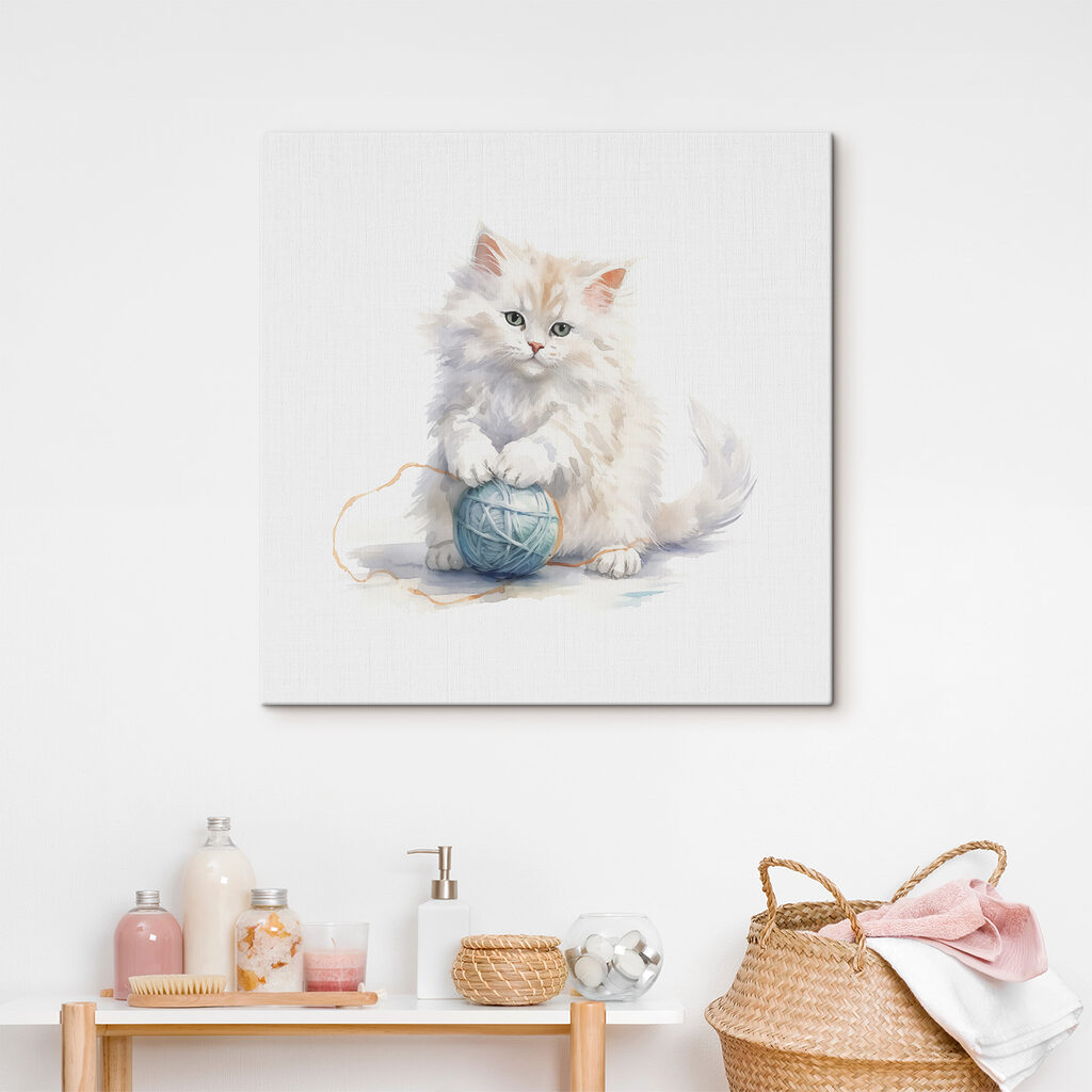 A cat playing with a ball of yarn