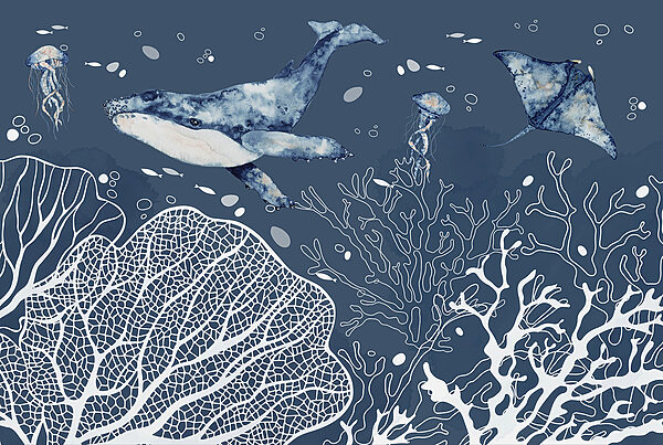 A whale and stingrays swimming in the ocean