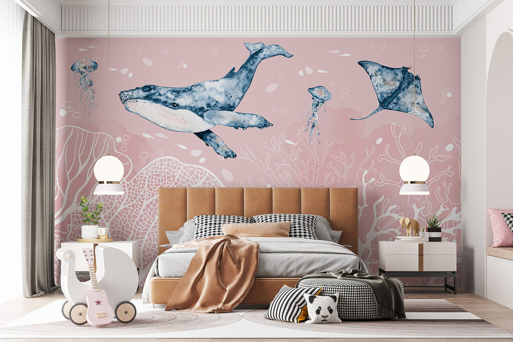 A whale and stingrays swimming in the ocean