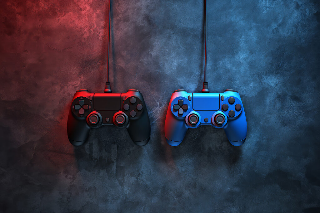 Un mando de videojuegos azul y rojo Un mando de videojuegos azul y rojo