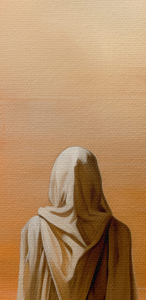 A person in a white robe standing in front of a pyramid