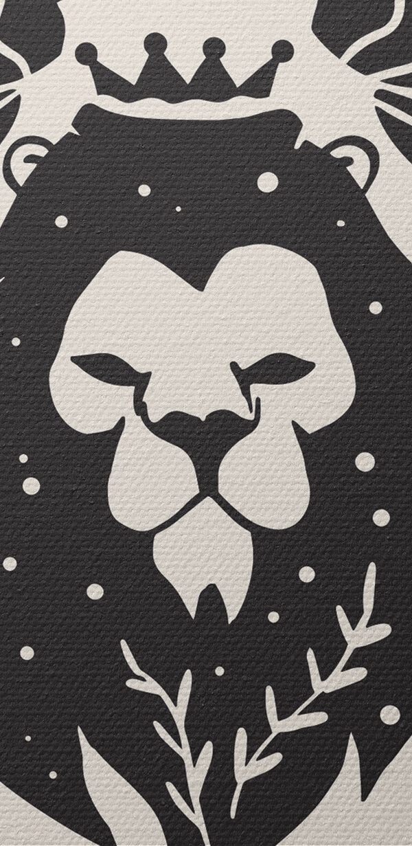 A black and white image of a lion with leaves and flowers