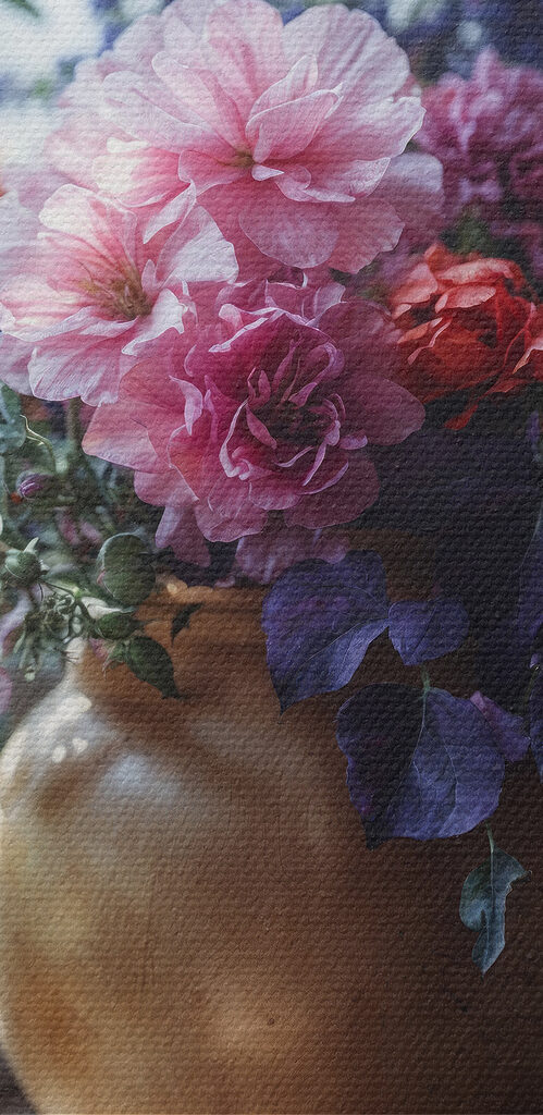 A vase of flowers on a window sill A vase of flowers on a window sill