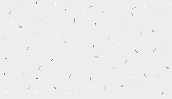A white and orange sprinkles on a gray background