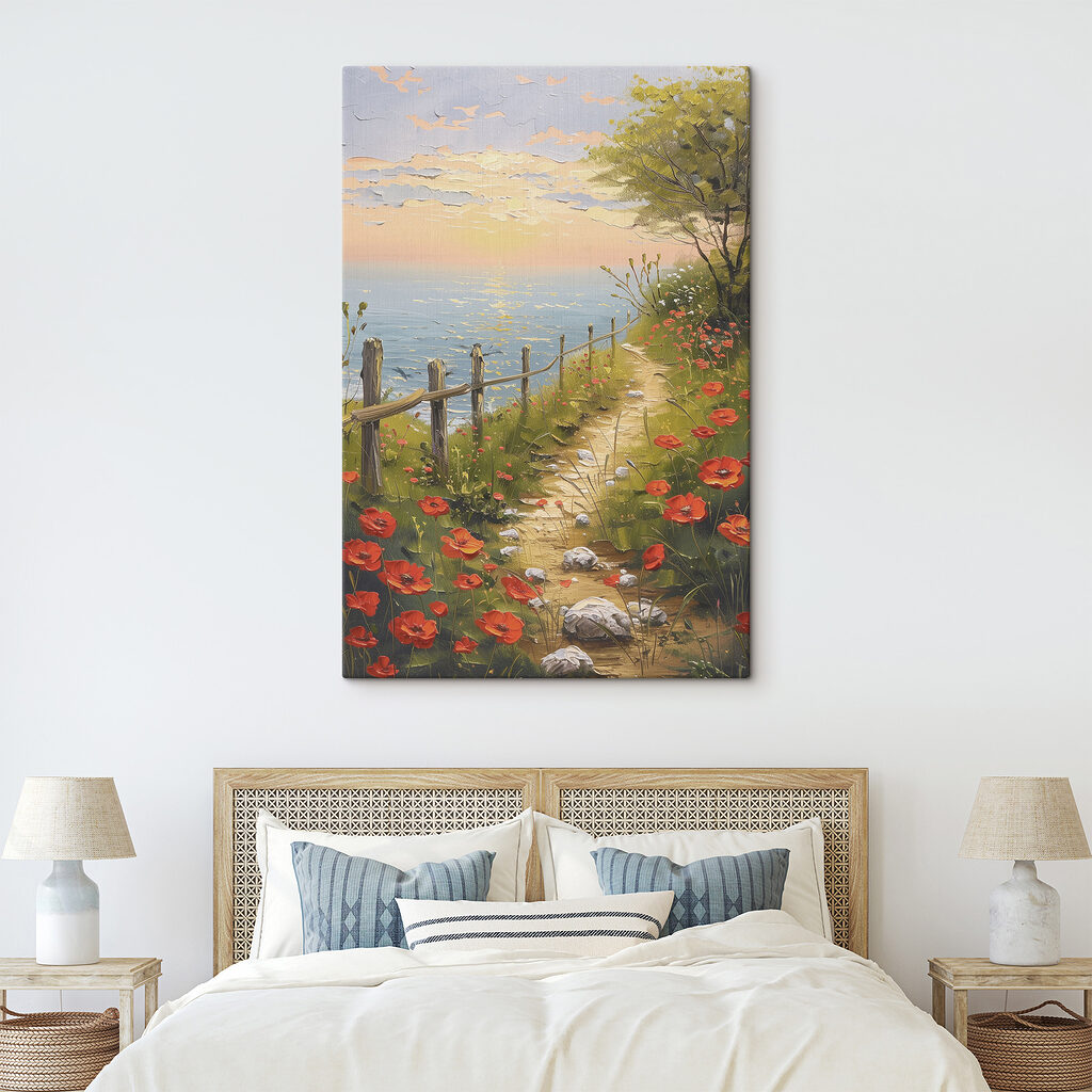 A path leading to a beach with red flowers