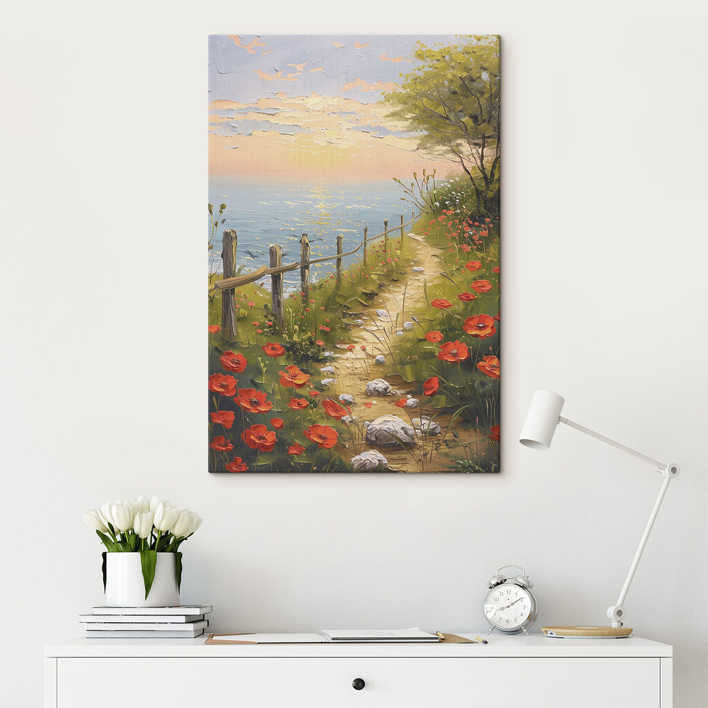 A path leading to a beach with red flowers