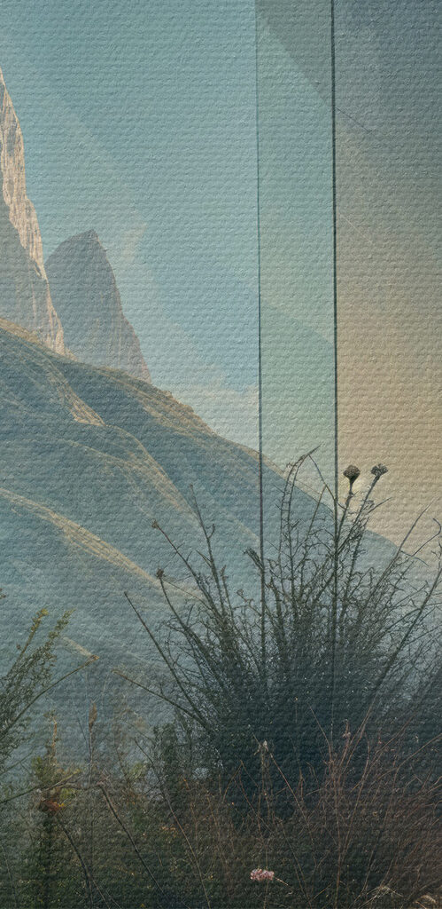 Building with a view of mountains and grass Building with a view of mountains and grass