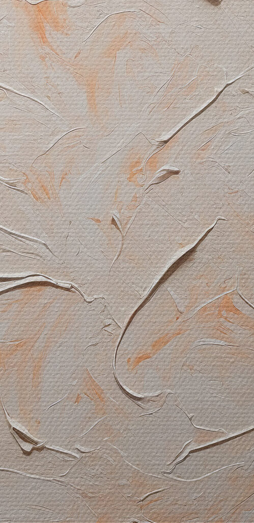 White and orange paint on a white surface