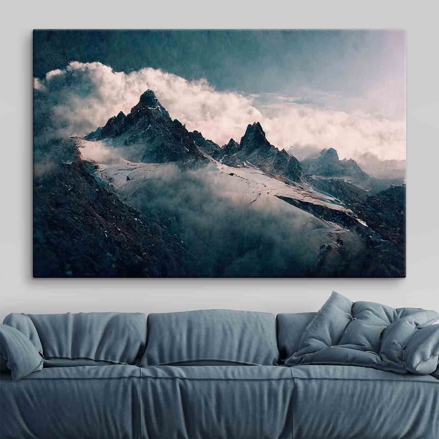 Snowy mountain tops with clouds