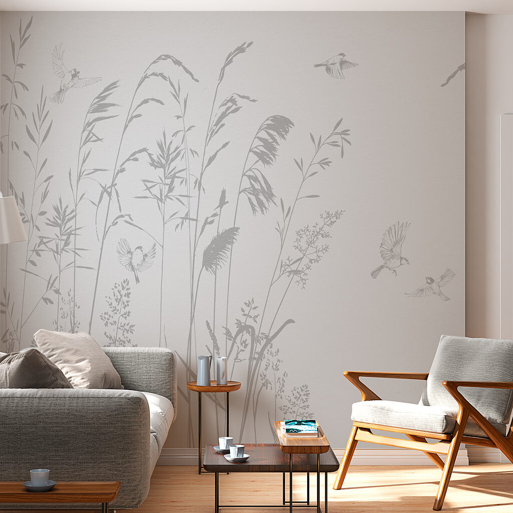 Birds flying over tall grass