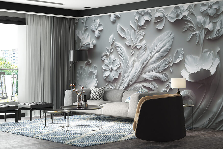 Pared blanca con flores y hojas