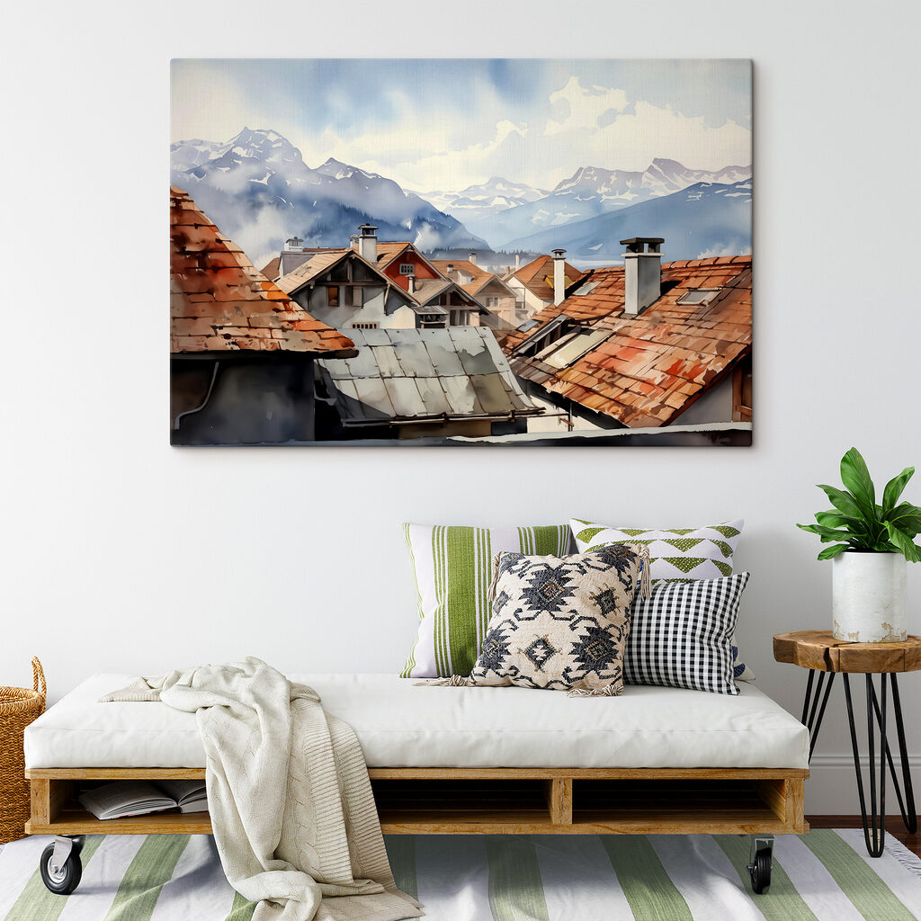 Group of houses with roofs and mountains in the background