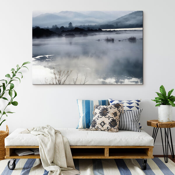 Foggy landscape with mountains and water