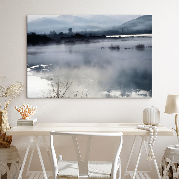 Foggy landscape with mountains and water