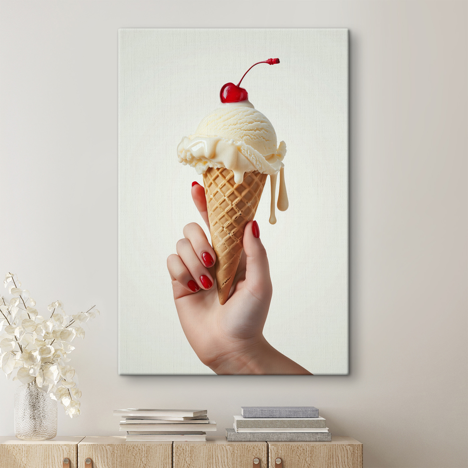 Hand holding an ice cream cone with a cherry on top Hand holding an ice cream cone with a cherry on top